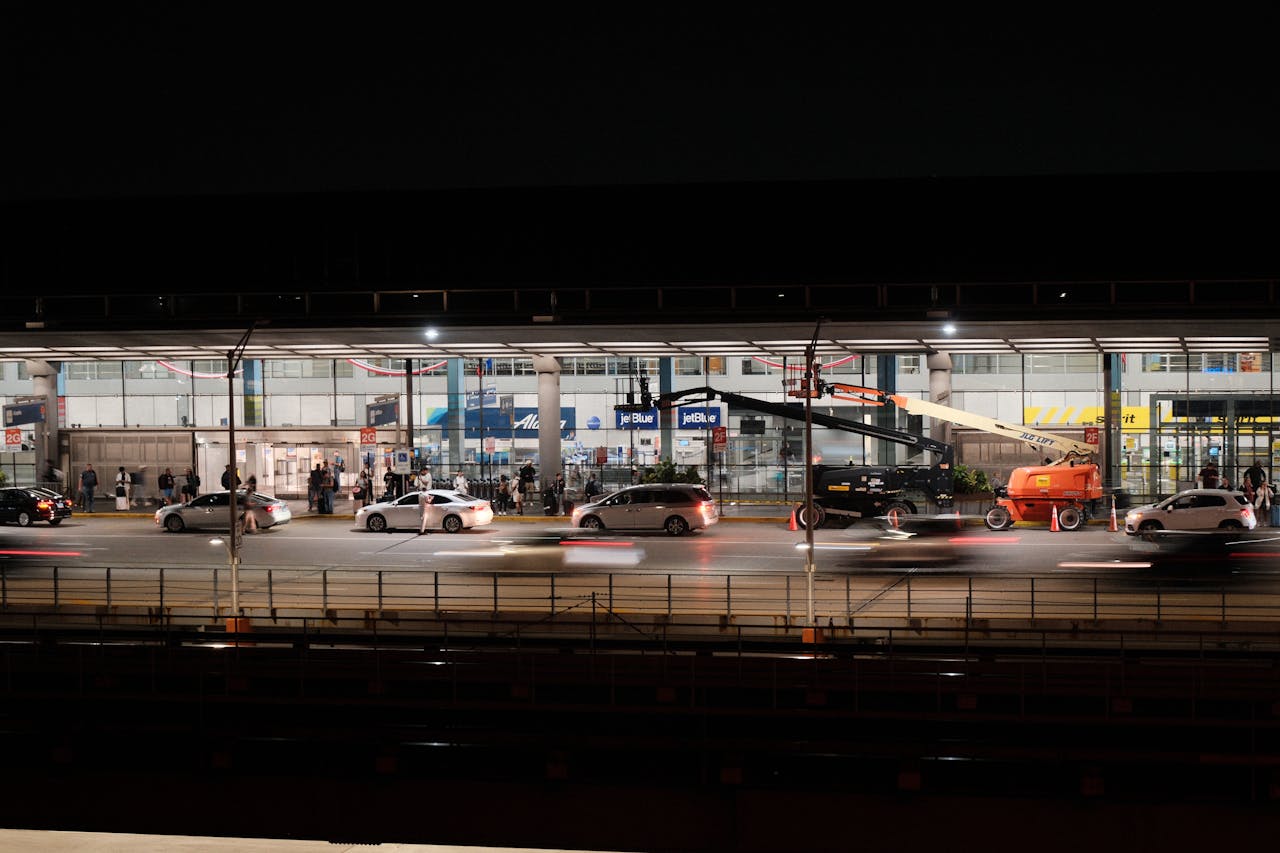 Long exposure captures bustling activity at Chicago O'Hare Airport during nighttime.